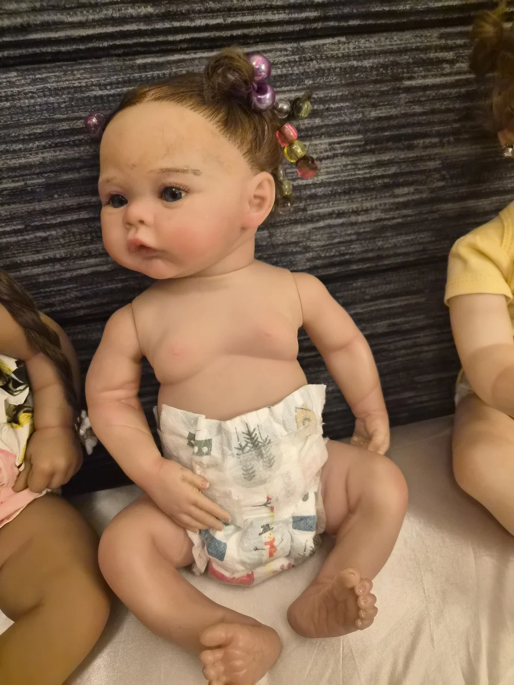 Reborn Baby Doll with Brown Hair and Pink Hair Beads